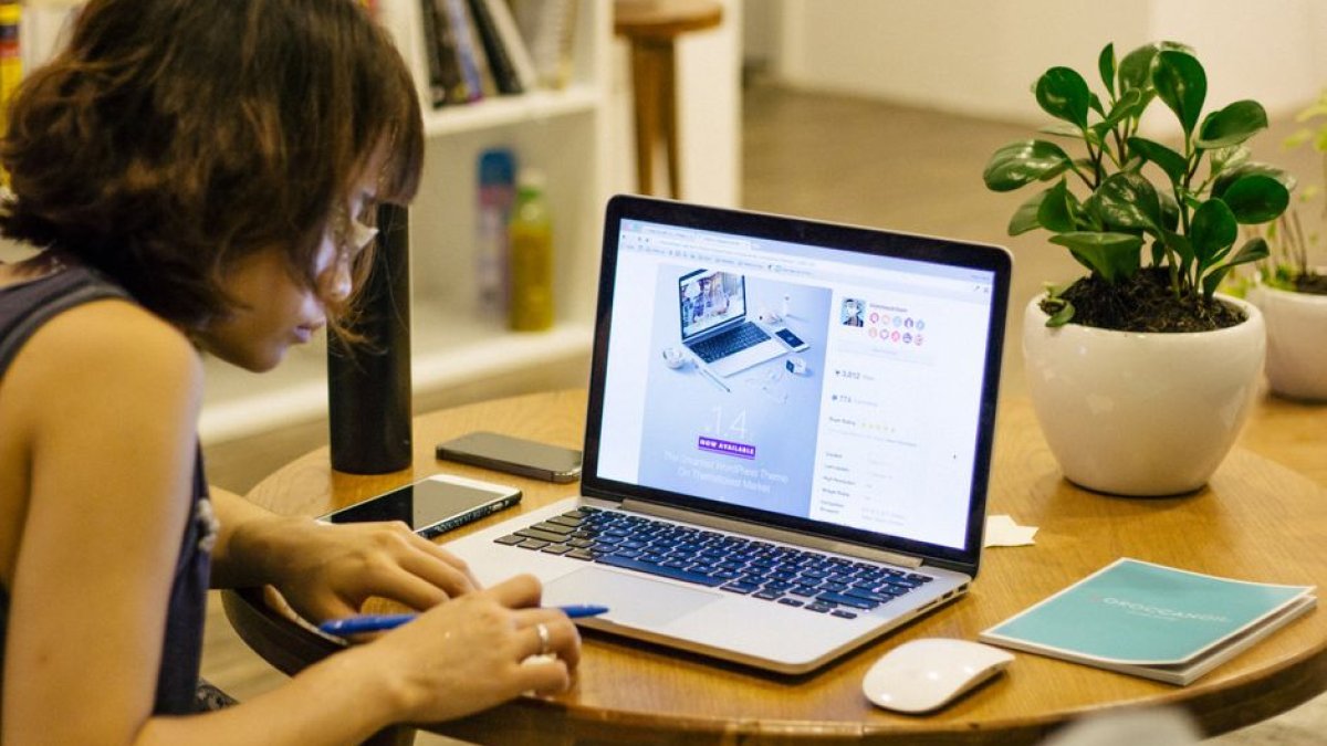 freelancer working laptop home desk
